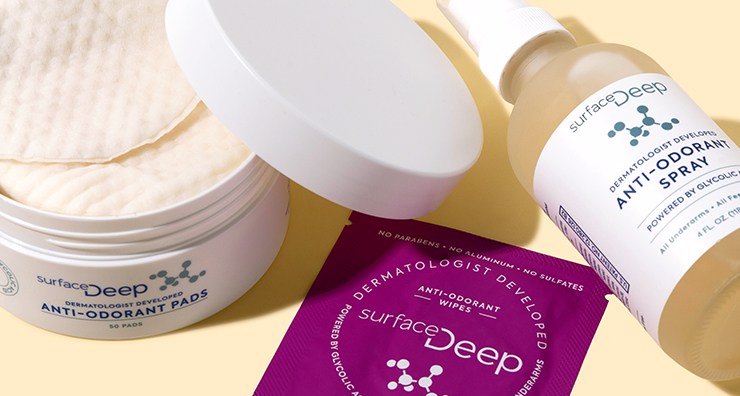 Surface Deep anti-odorant products: open pad container, wipes packet, and spray bottle on a yellow background
