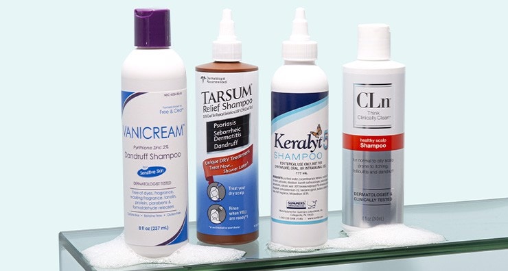 Bottles of therapeutic shampoo from Vanicream, Tarsum, Keralyt and CLn on a light blue background