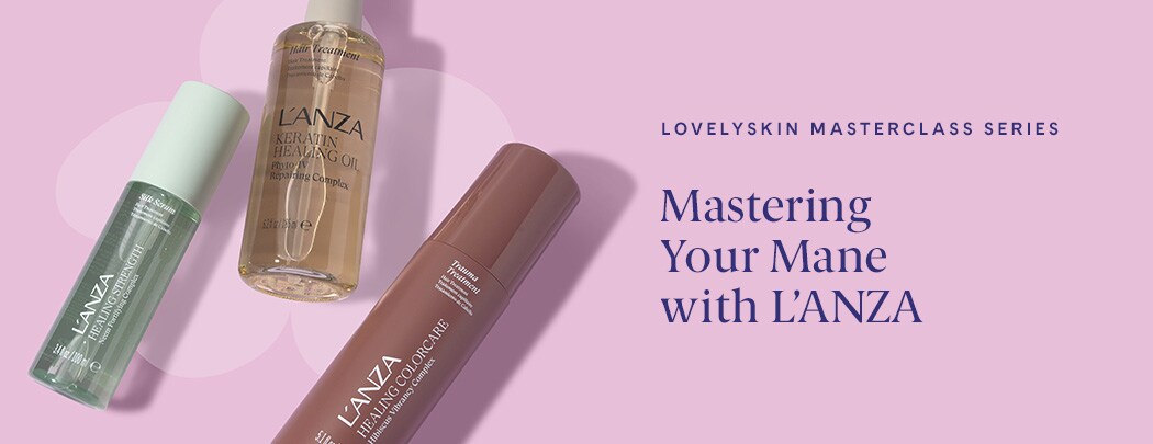 Three hair products lay next to one another on a pink background. One is gold, one is soft green and one is rose gold.