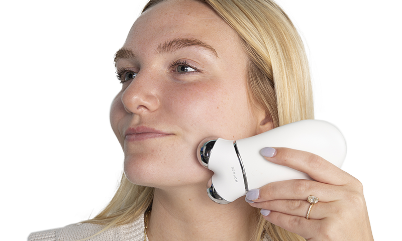 Woman with NuFACE device