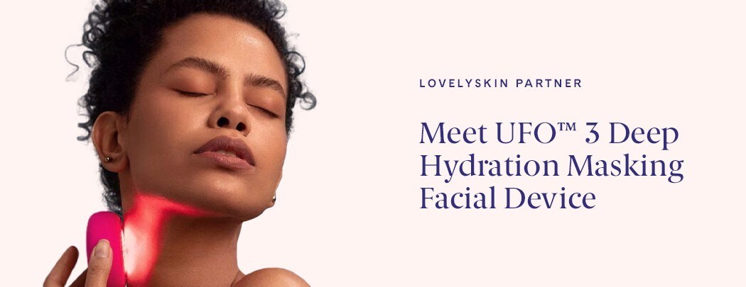 A woman holding the FOREO UFO 3 Deep Hydratration Facial device to her face