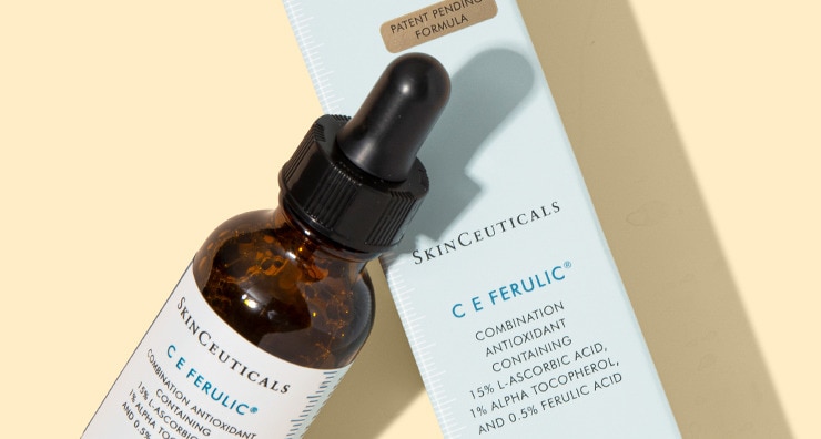SkinCeuticals C E Ferulic serum bottle and box on a light yellow background with soft shadows