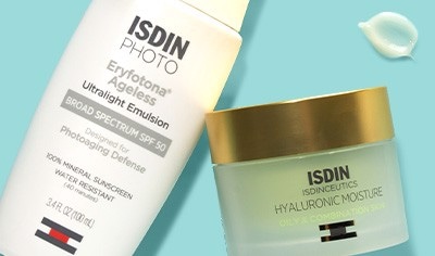 Containers of ISDIN sunscreen and moisturizer on a turquoise background.