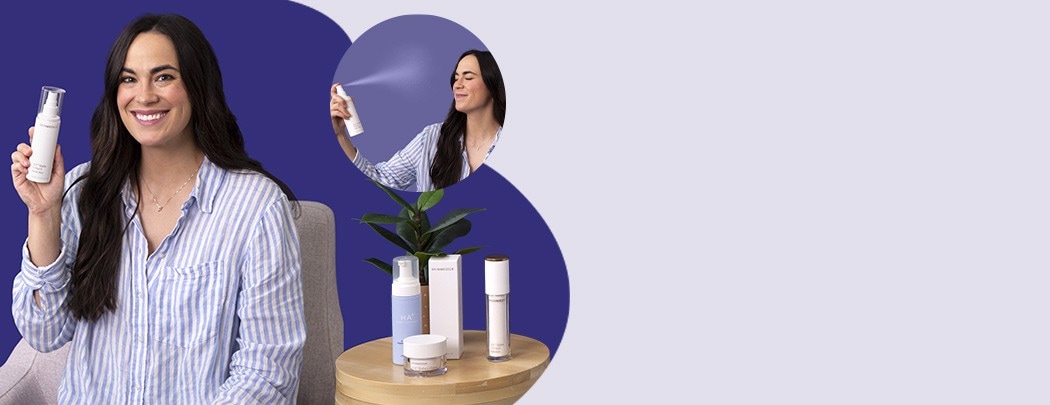 A woman with an olive skin tone and dark brown hair holds a bottle of SkinMedica HA5 Hydra Collagen Facial Mist while smiling at the camera.