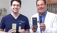 Board-certified dermatologists Drs. Joel and Daniel Schlessinger stand together while holding Alto Advanced Serum and AlphaRet Overnight Cream.