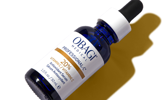 A bottle of Obagi Hydrate Facial Moisturizer laying next to a swatch of product.