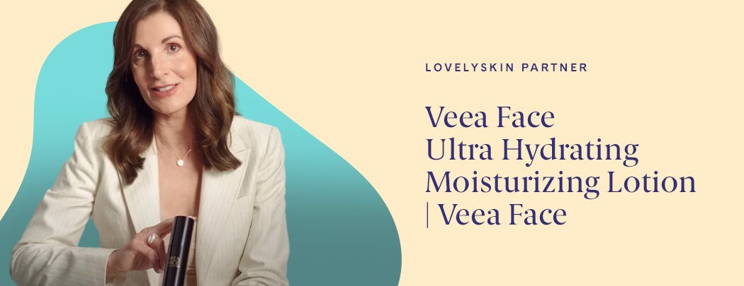 Dr. Suzan Obagi Holds a bottle of Veea Face Ultra Hydrating Moisturizing Lotion. She has medium length brown hair and is wearing a white blazer.