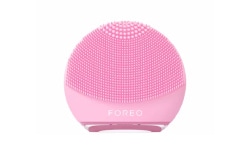 Tools & Accessories arranged on a green table. Shop LovelySkin for FOREO, Joylux and other top brand skin care tools and accessories.