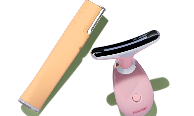 An orange DERMAFLASH device next to a pink Skin Gym device.