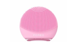 Tools & Accessories arranged on a green table. Shop LovelySkin for FOREO, Joylux and other top brand skin care tools and accessories.