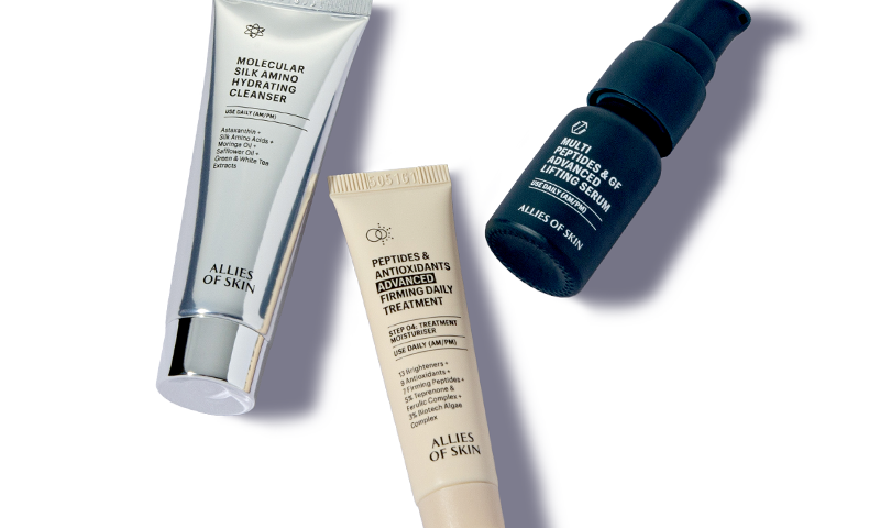 A skin care set with the products laid out individually.