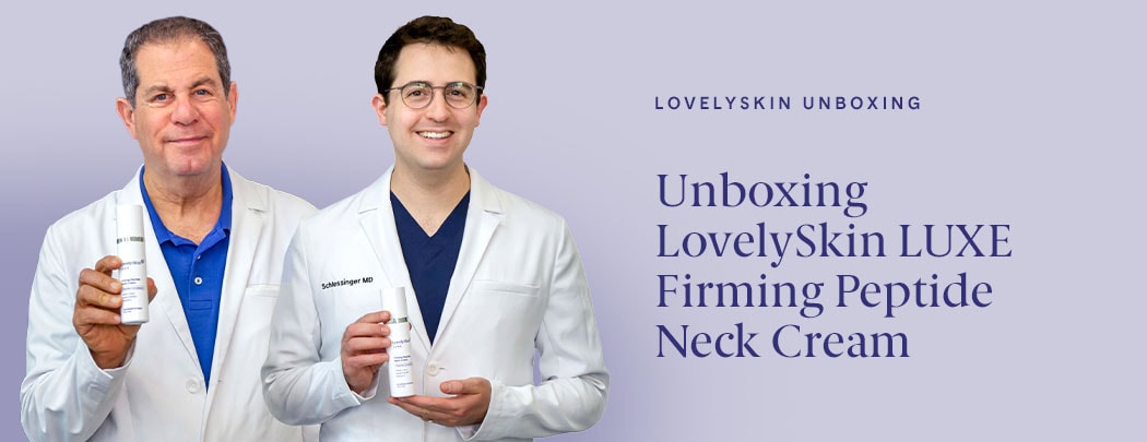 Drs. Joel and Daniel Schlessinger stand next to one another smiling while holding LovelySkin LUXE Firming Peptide Neck Cream.
