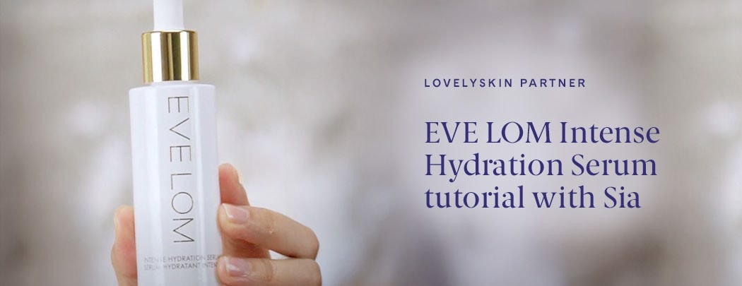 Hand holding a bottle of EVE LOM Intense Hydration Serum