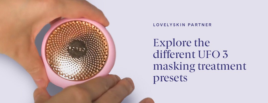 Hands holding a FOREO UFO 3 skin care device