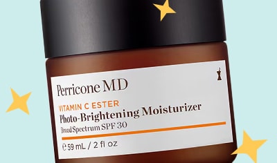 A jar of Perricone MD Vitamin C Ester Photo-Brightening Moisturizer Broad Spectrum SPF 30 with a blue background and sparkle illustrations.