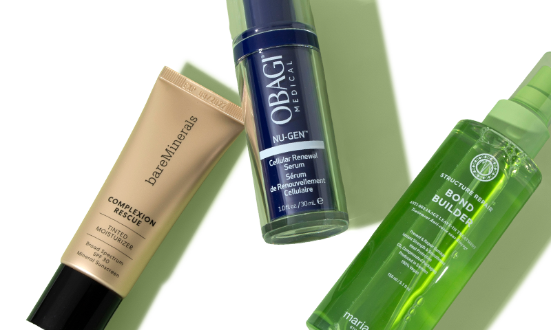 Three skin care products lying next to each other