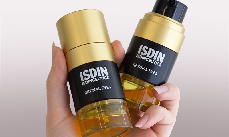 Hand holding two product bottles