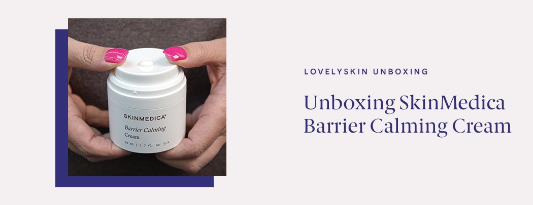 A person with pink fingernails holds a jar of SkinMedica Barrier Calming Cream while pressing down on the airless pump jar to dispense product.