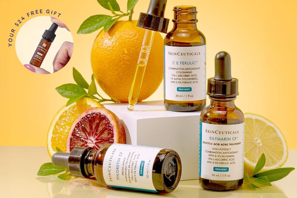SkinCeuticals Vitamin C serums on risers with various citrus + your free $24 free gift