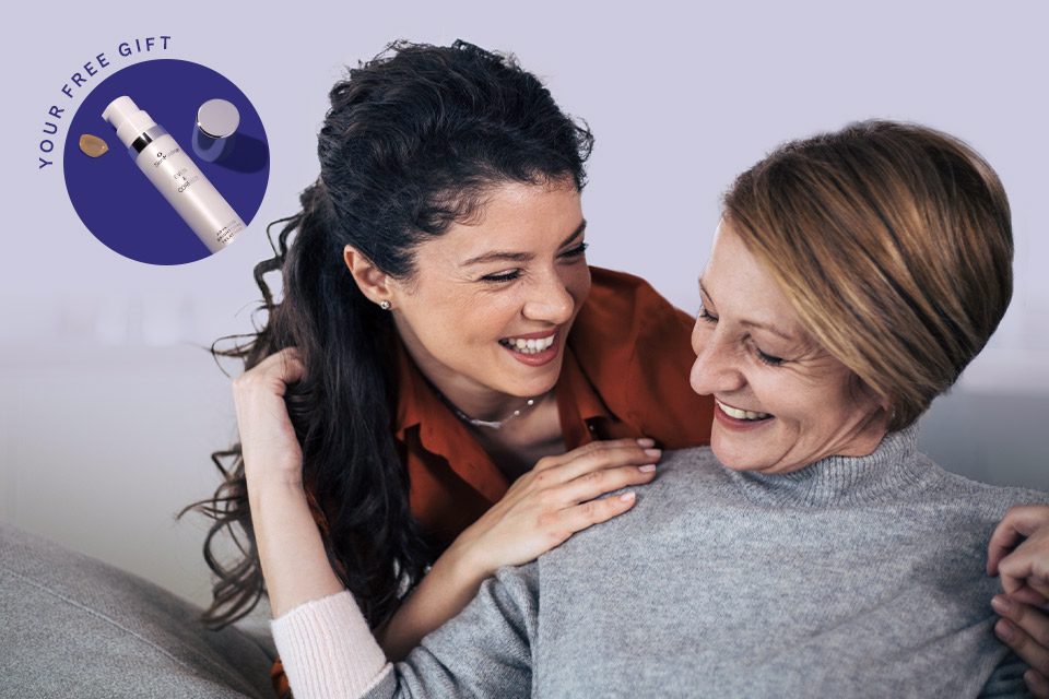 Mature mother and daughter laughing together