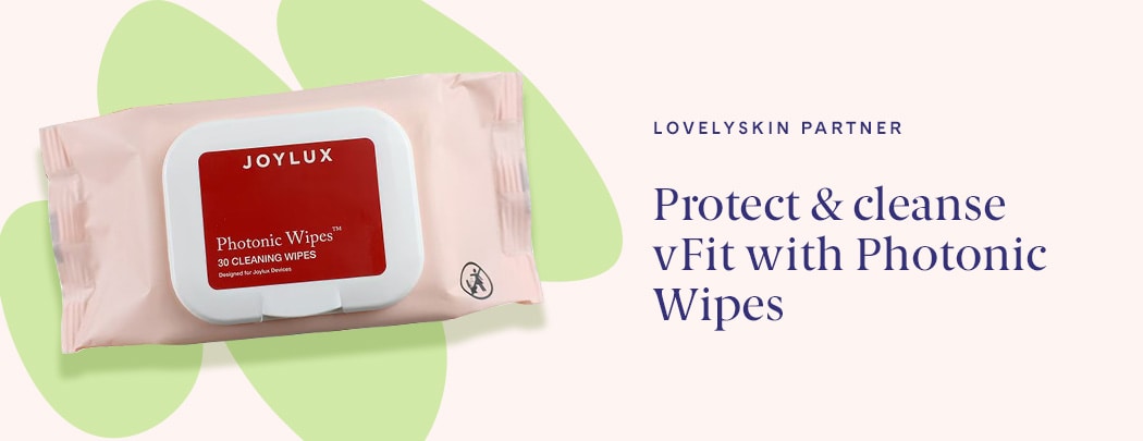 A package of Joylux Photonic Wipes™ Device Cleaning Wipes sits atop a digital illustration. The illustration is green and squiggly.