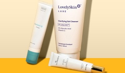 SkinCeuticals Glycolic Renew Overnight treatment and SkinCeuticals retinol night cream on a violet background
