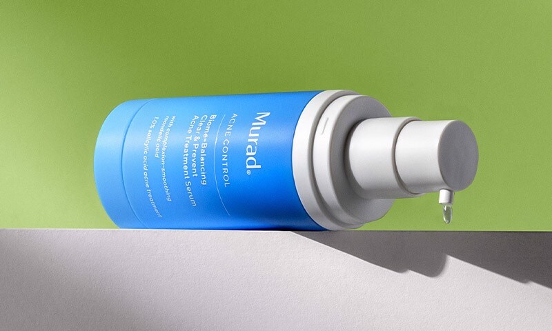 Bottle sitting on ledge dispensing product