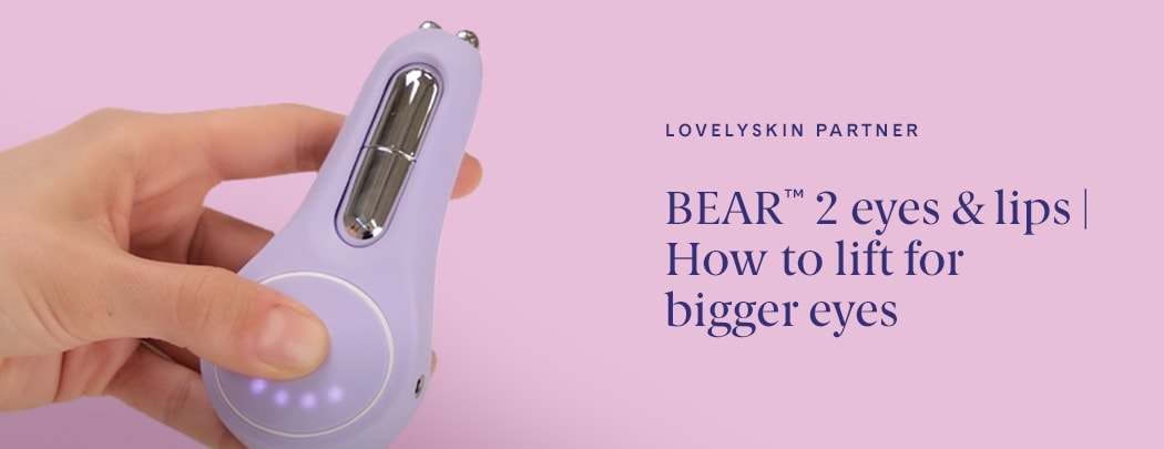 Hand holding the FOREO BEAR 2 eyes & lips device