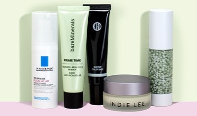 Green-tinted facial primers and makeup from La Roche-Posay, bareMinerals, Indie Lee, jane iredale and more on a light green background