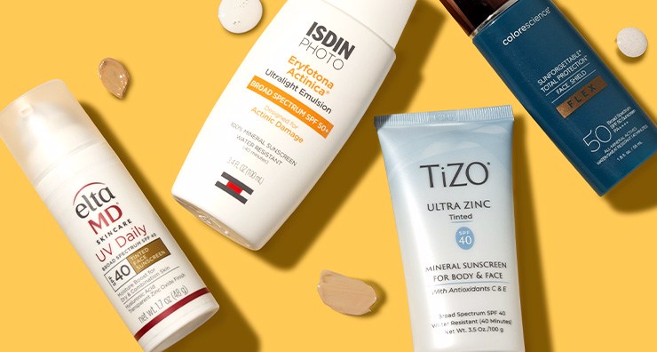 Sunscreens from EltaMD, ISDIN, TiZO and Colorescience on a yellow background.