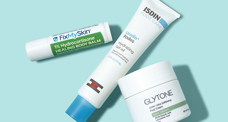 A tube of FixMySkin lip balm and containers of ISDIN and Glytone moisturizers pictured on a light blue background.