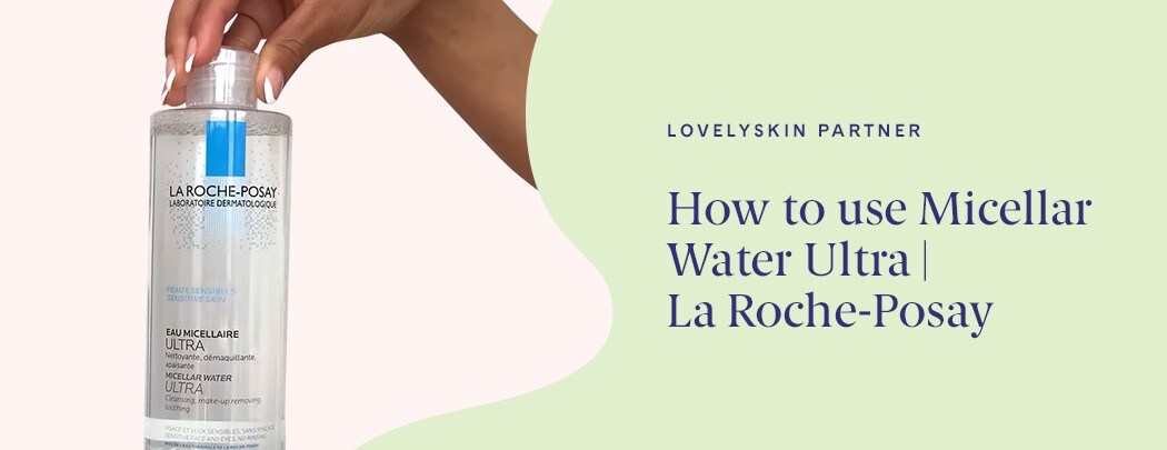 A black woman's manicured hand holds a bottle of La Roche-Posay's Micellar Water Ultra