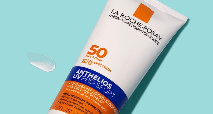A white tube of La Roche-Posay Anthelios Pro-Sport Sunscreen with orange and black writing on a light blue background.
