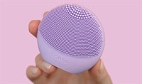 Hand holding a FOREO LUNA Play Plus 2 device
