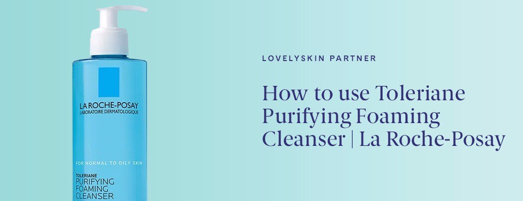 A blue bottle with a white pump of La Roche-Posay Toleriane Purifying Foaming Cleanser on a light blue background