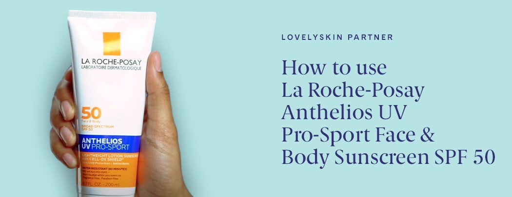 A hand with a medium skin tone holds a white bottle of La Roche-Posay Anthelios UV Pro-Sport Face & Body Sunscreen SPF 50