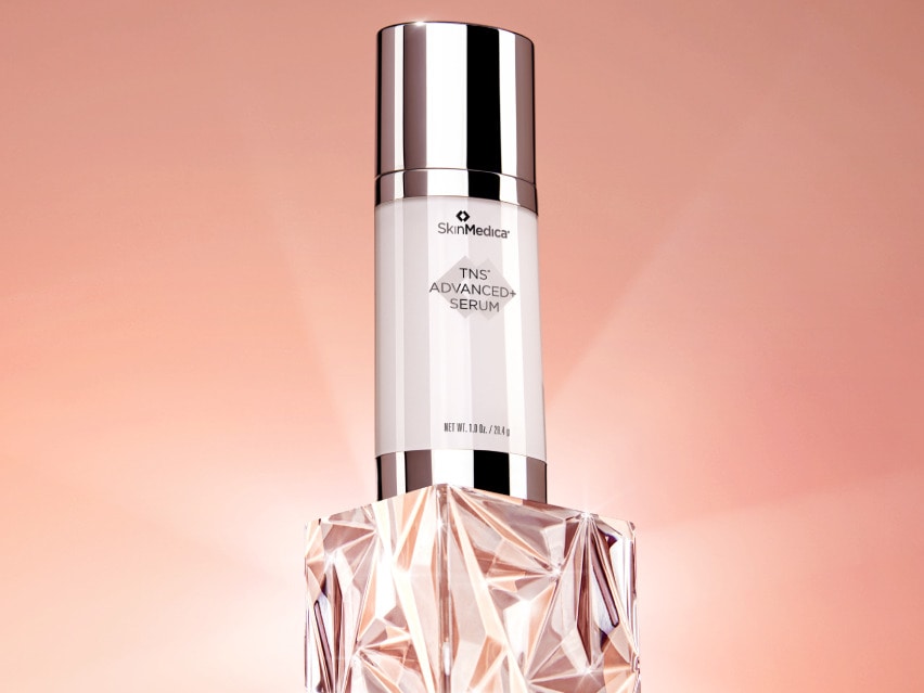 SkinMedica TNS® Advanced+ Serum on a crystal with light shining behind it