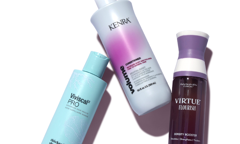 Three hair products laying next to each other