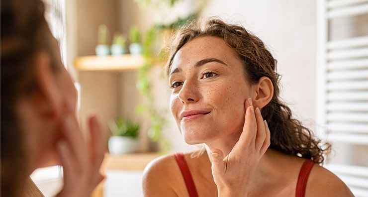 woman checking her complexion