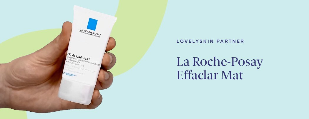 Hand holding white bottle of La Roche-Posay Effaclar Mat on light blue background with green illustrative element