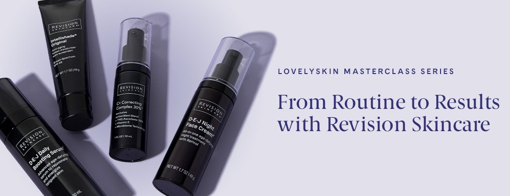 Four Revision Skincare products in black and white packaging lay on a soft purple background.