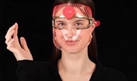 Woman wearing the FOREO FAQ 201 LED light mask
