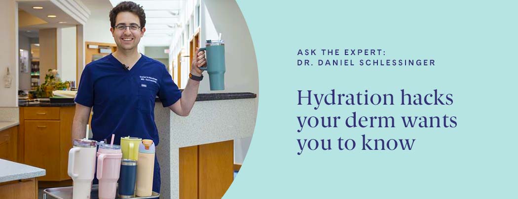 A Doctor Stands with a glass of water