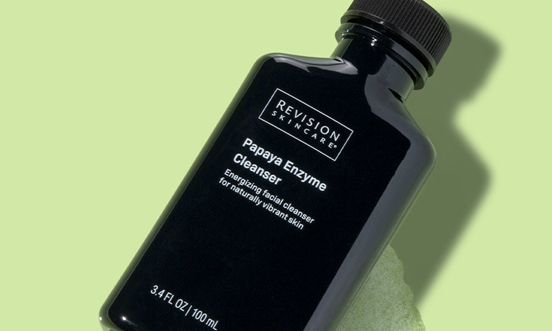 Product bottle laying in suds