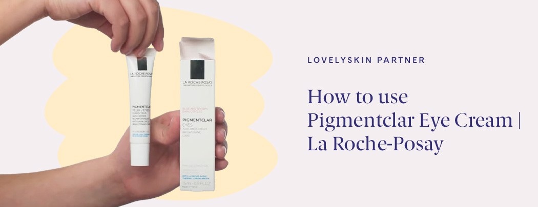Two hands holding La Roche-Posay Pigmentclar Eye Cream tube and box