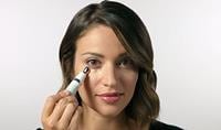 Woman using Colorescience Total Eye 3-in-1 Renewal Therapy. How to use Colorescience Total Eye 3-in-1 Renewal Therapy.