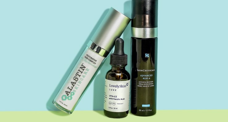 Three firming serums from ALASTIN, LovelySkin LUXE and SkinCeuticals pictured on a light blue background.