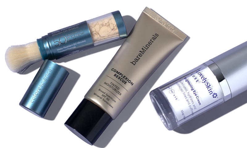 Three skin care products lying next to each other